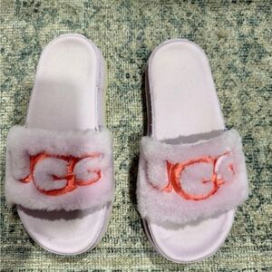 UGG Light Pink Fluffy Slides with Orange Logo